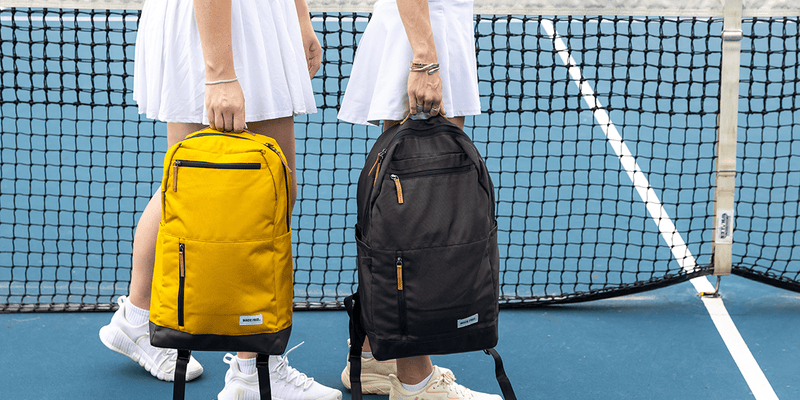 Two College Girls Carrying College Backpacks
