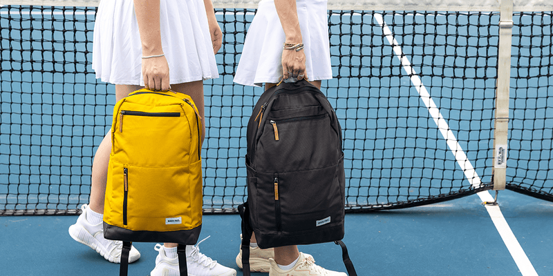 Two College Girls Carrying College Backpacks