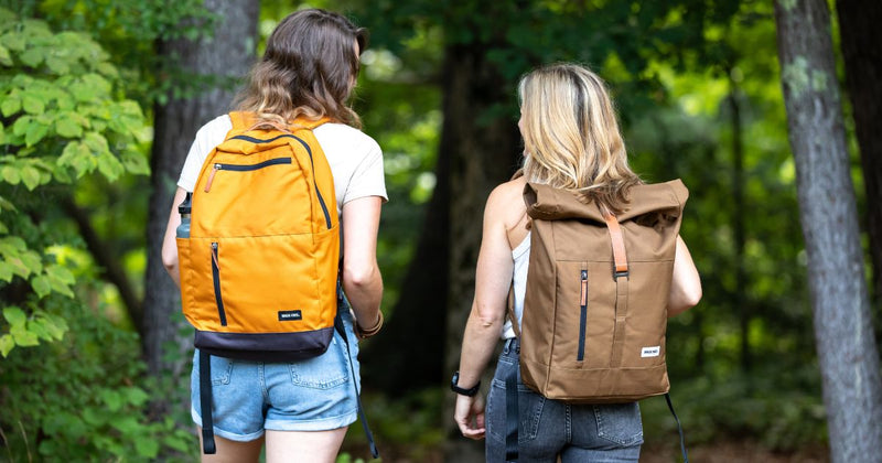 travelers wearing recylced polyester backpacks from MADE FREE–sustainably and ethically made