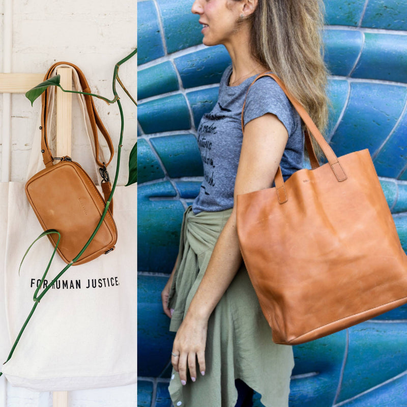 woman holding leather tote purse