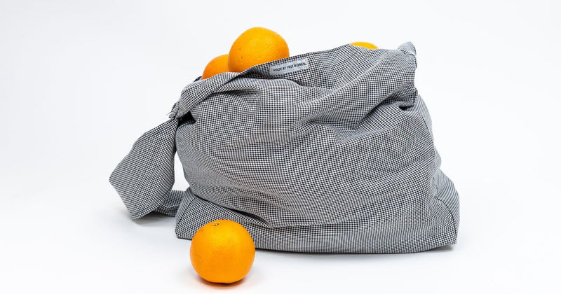 houndstooth tote filled with oranges