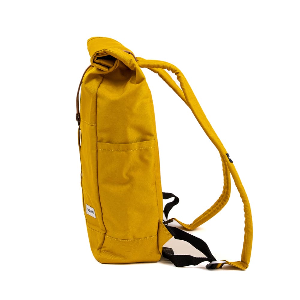 lightweight roll top backpack. best roll top backpack waterproof. canvas roll top bag. best roll top backpack. rolling backpacks. eco friendly roll top backpack. 100recycled backpack. socially responsible backpacks. backpacks made from recycled materials. sustainable travel bag. mustard yellow