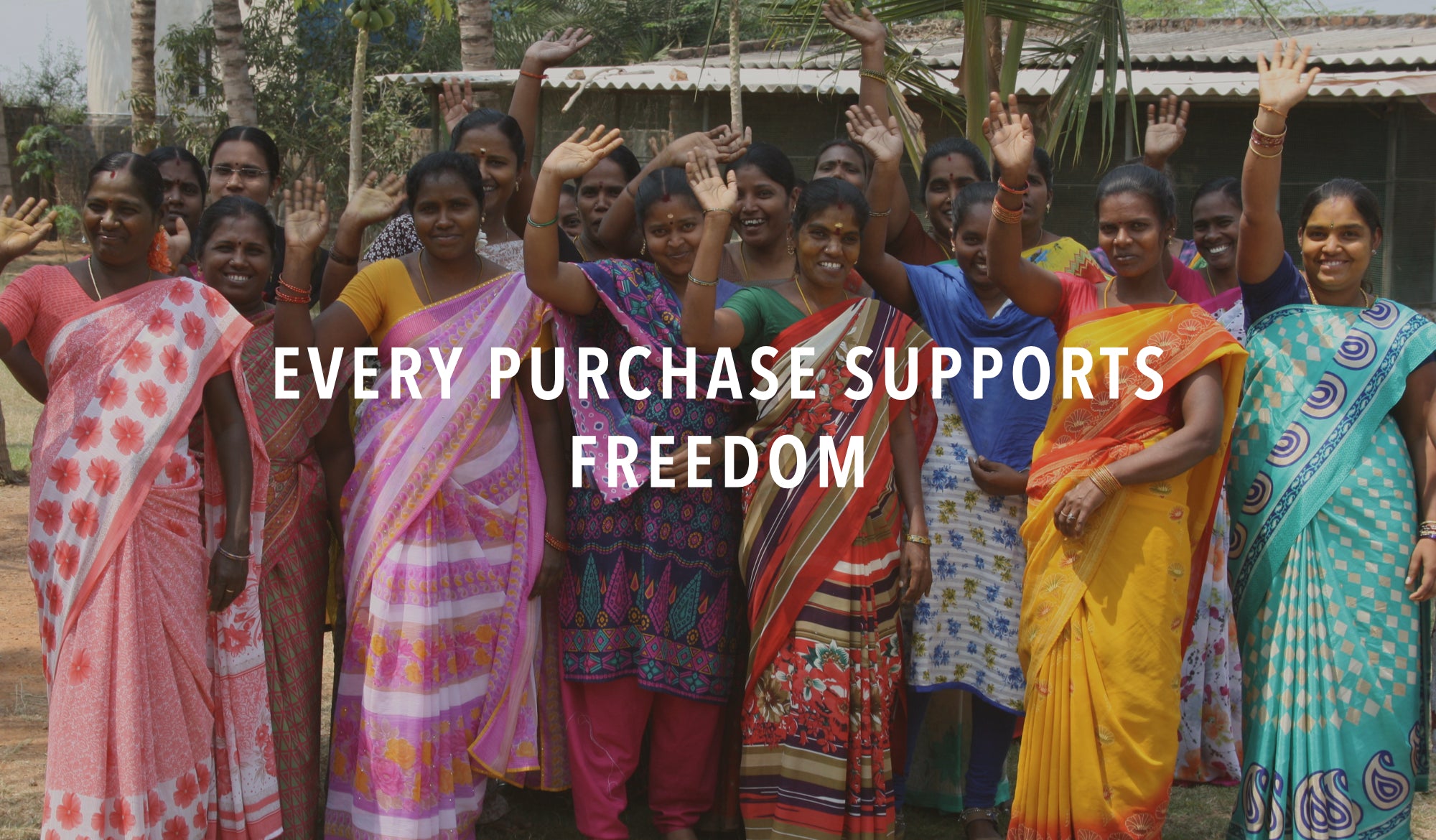 Group of joyful women artisans outside of ethical factory supporting fair trade. 