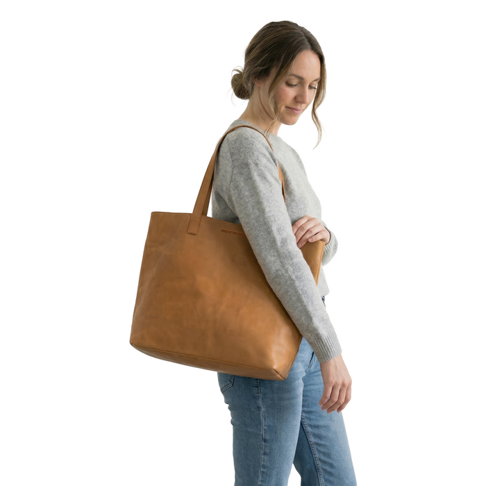 MADE FREE Day Tote Leather in camel worn by model in studio setting