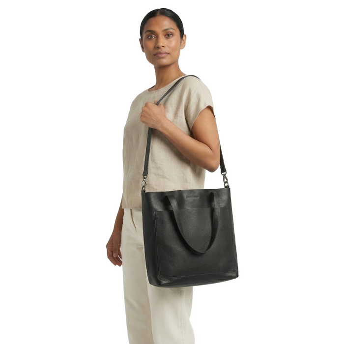 MADE FREE Day Tote Leather Medium in black worn by model in studio setting