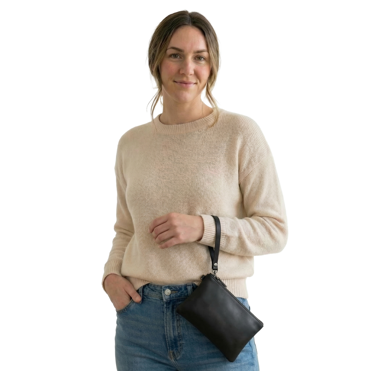 MADE FREE Leather Clutch in black worn by model in studio setting