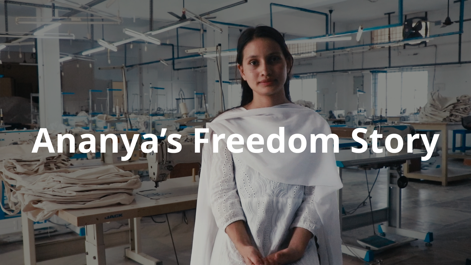 A woman named Ananya walks through a bustling street while holding her phone. The subtitle reads, "I'm Ananya, a proud maker at MADE FREE," showcasing her role in ethical fashion.